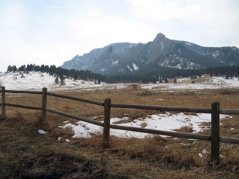 The Flatirons rising above the meadow at Chautauqua Park, Boulder