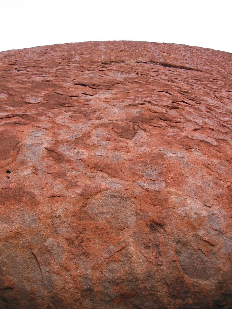 Uluru sandstone monolith rising from the desert of Australia's Red Centre