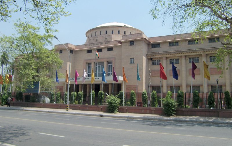 National Museum building facade with flags, New Delhi