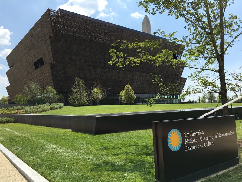 The tiered bronze exterior of the National Museum of African American History and Culture