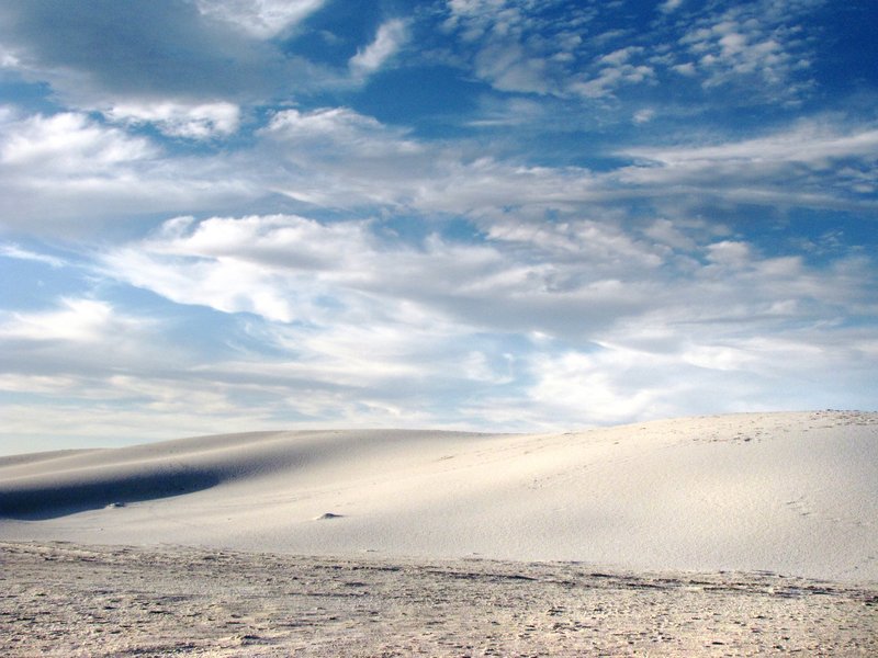 White gypsum sand dunes under open sky at White Sands National Park