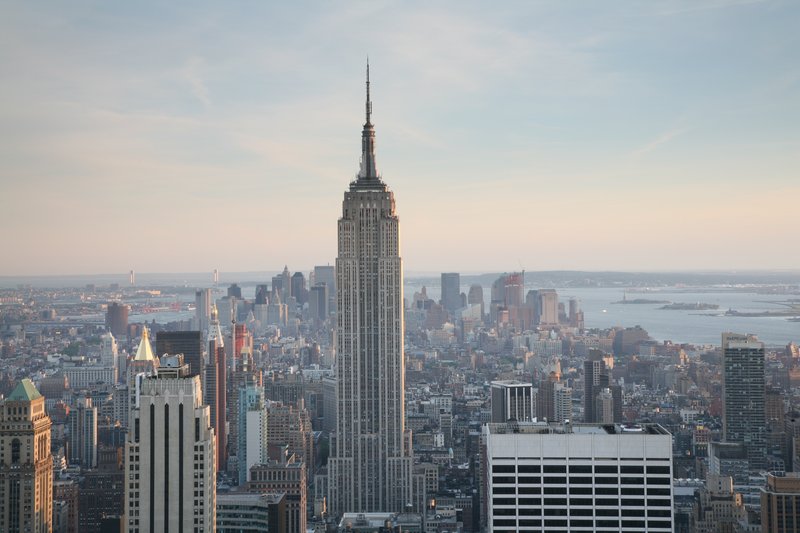The Empire State Building rising above Midtown Manhattan at dusk