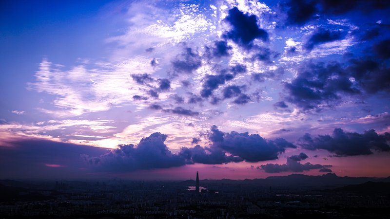 Lotte World Tower against Seoul's evening skyline