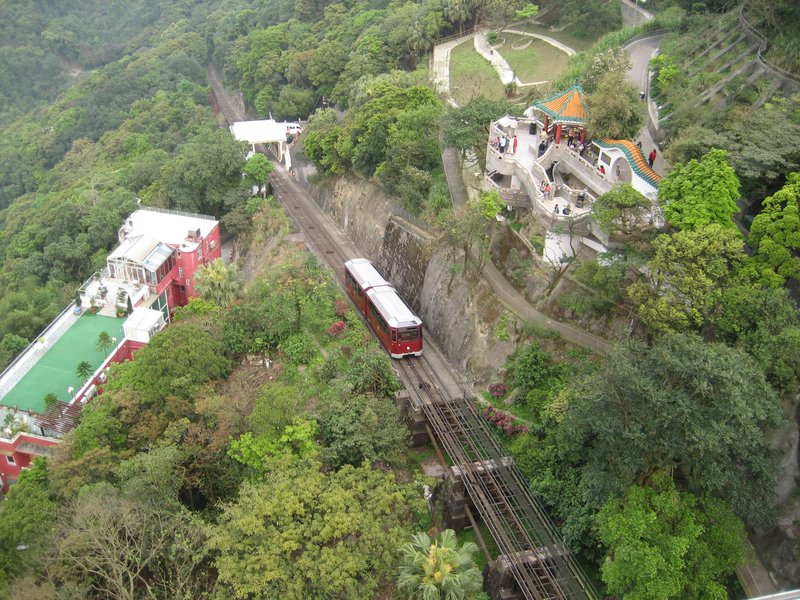 The historic Peak Tram approaching the Peak Tower on Victoria Peak, Hong Kong