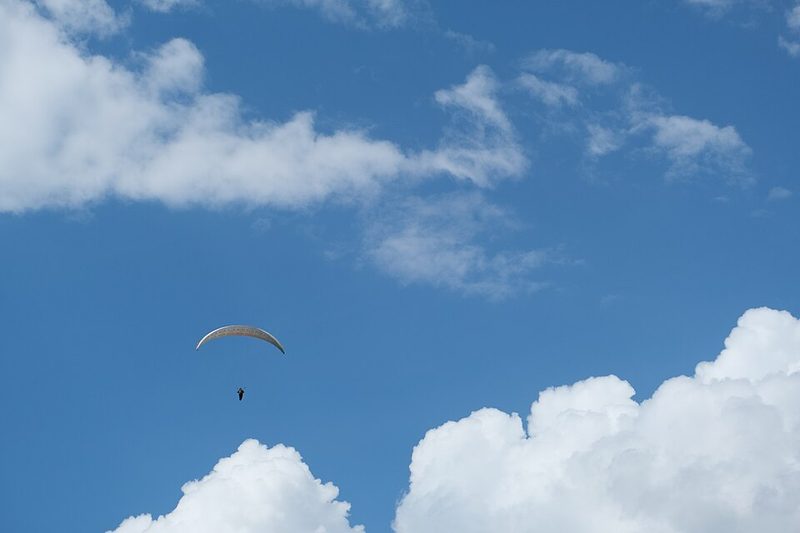 Paraglider launching from the Col de la Forclaz above Lake Annecy