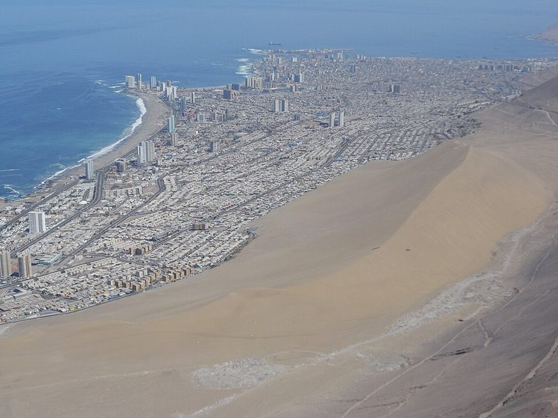 Cerro Dragón dune and the city of Iquique on the Pacific coast of Chile