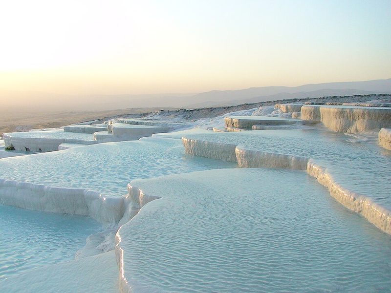 The white travertine terraces of Pamukkale below Hierapolis