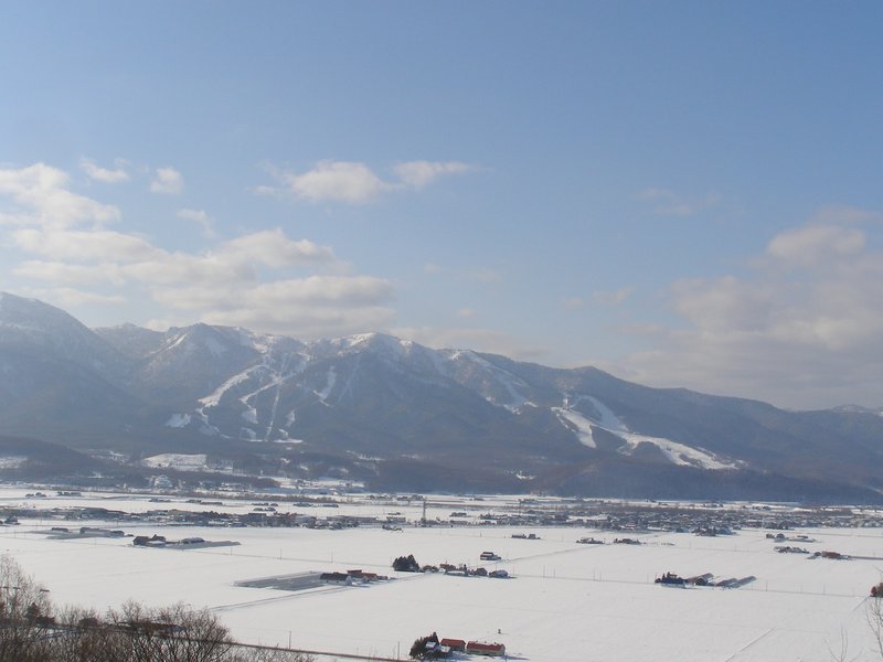 Ski runs on the mountains above Furano, with the snow-covered valley below