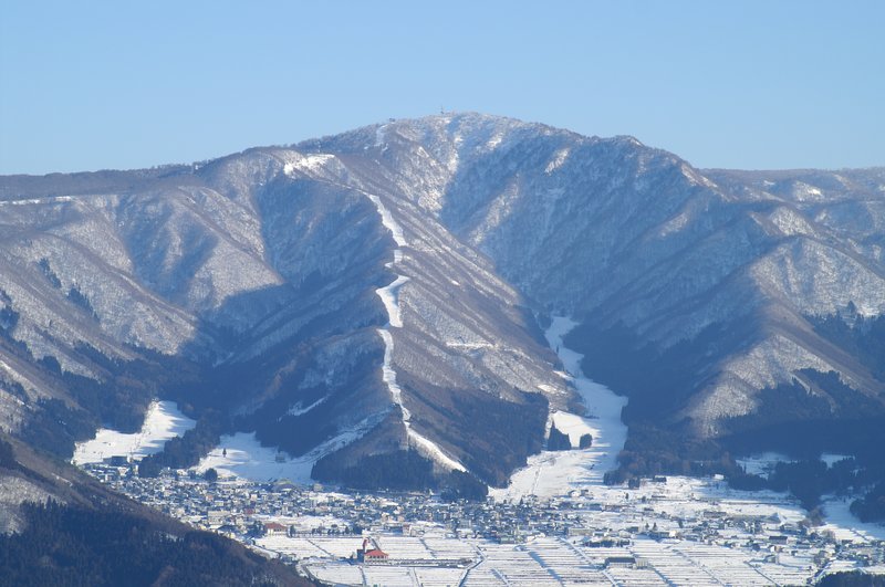 Ski runs cut into the mountain above Nozawa Onsen village, Nagano
