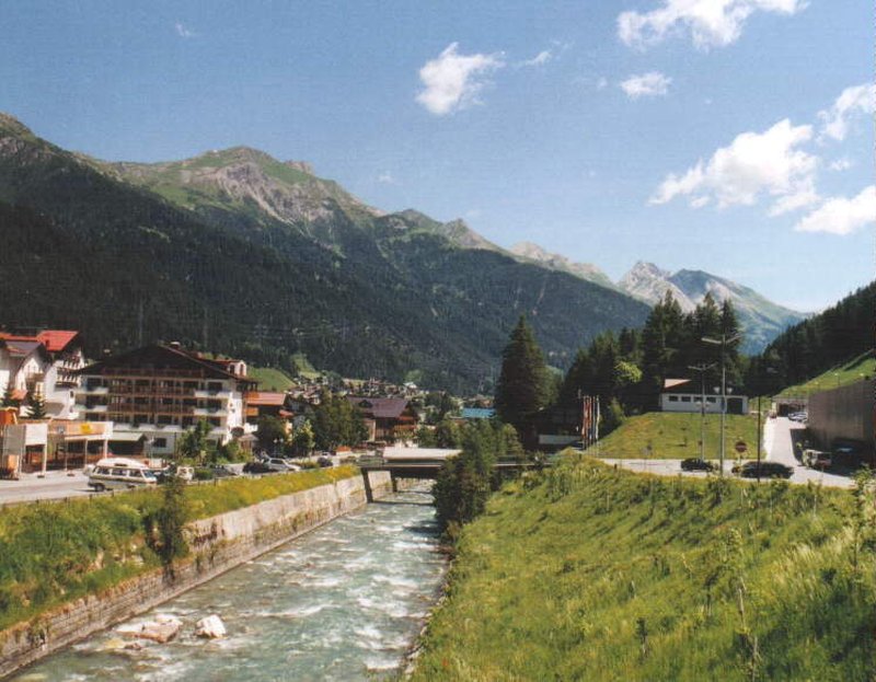 St. Anton am Arlberg village along the river, backed by Tyrolean peaks