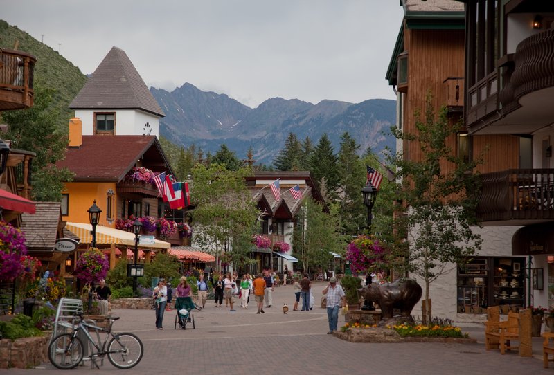Pedestrian village street in Vail with the Gore Range behind