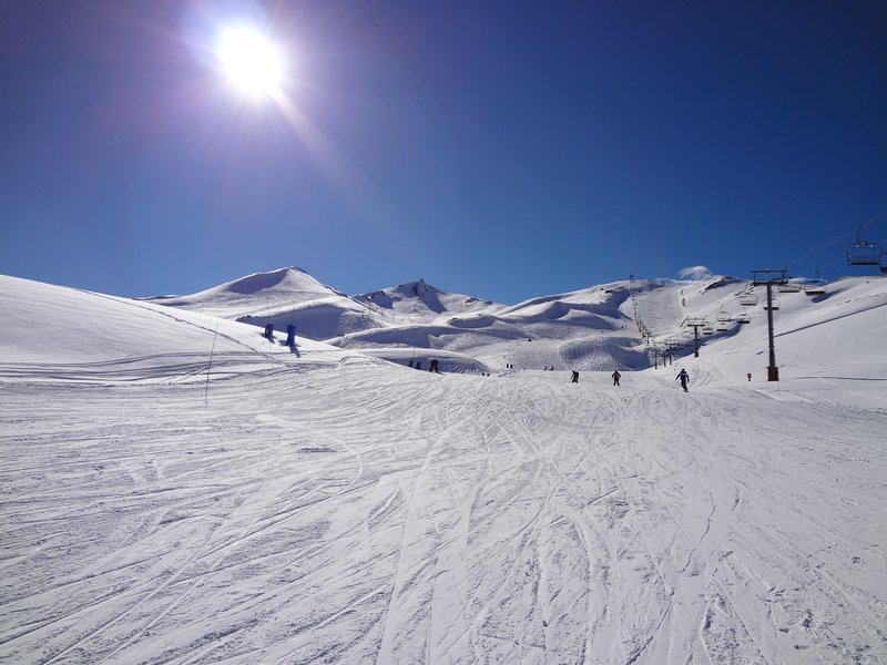 Sunny ski slope and lift line at Valle Nevado in the Andes above Santiago