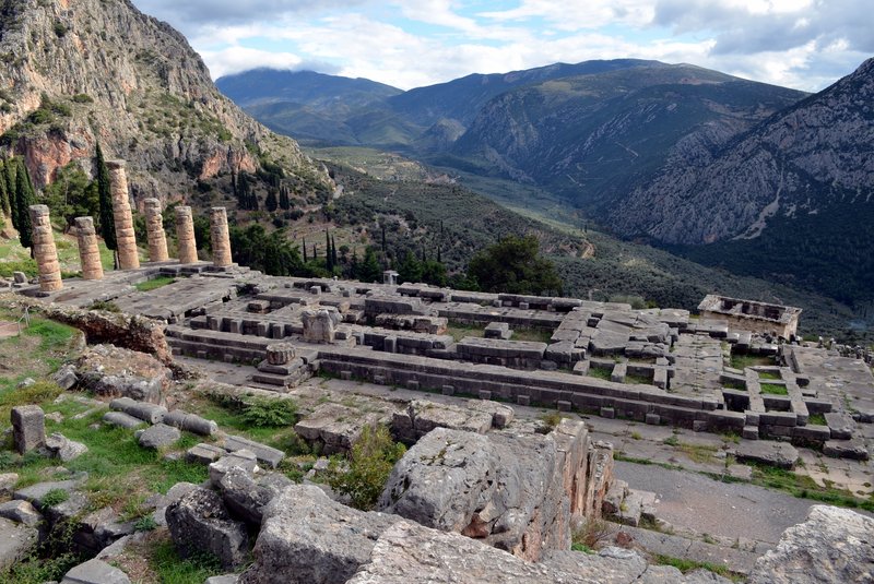 Temple of Apollo ruins with Mount Parnassus behind at Delphi