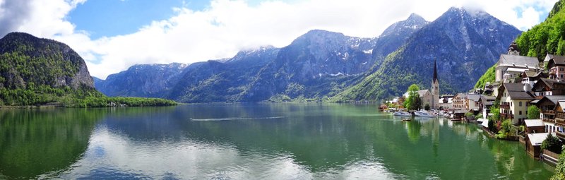 Hallstatt village reflected in the Hallstätter See with mountain backdrop