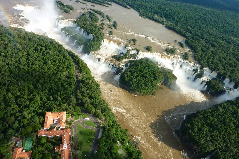 Aerial view of Iguazu Falls from above the forest canopy