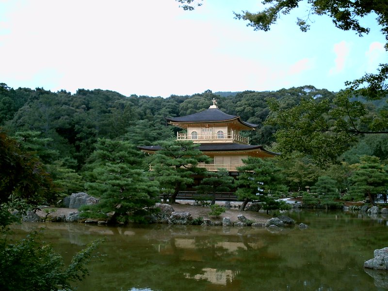 Kinkaku-ji golden pavilion reflected in the mirror pond in Kyoto