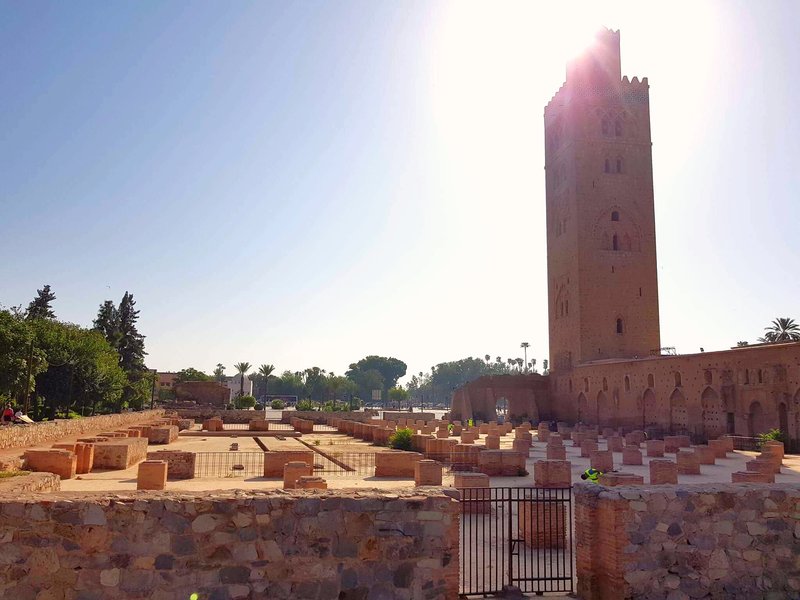 Koutoubia Mosque minaret rising above the Marrakesh medina palm trees