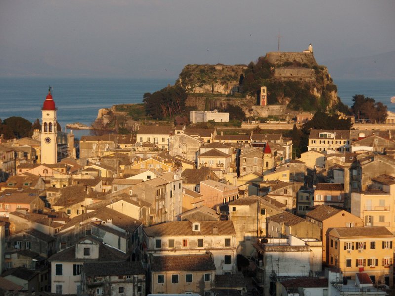 Corfu Old Town rooftops with the Old Fortress on its headland behind