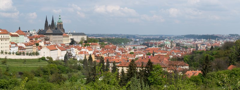 Prague's historic centre seen from Petřín Hill with rooftops and spires