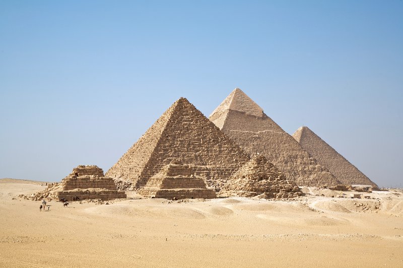 The three Great Pyramids of Giza seen from the desert plateau