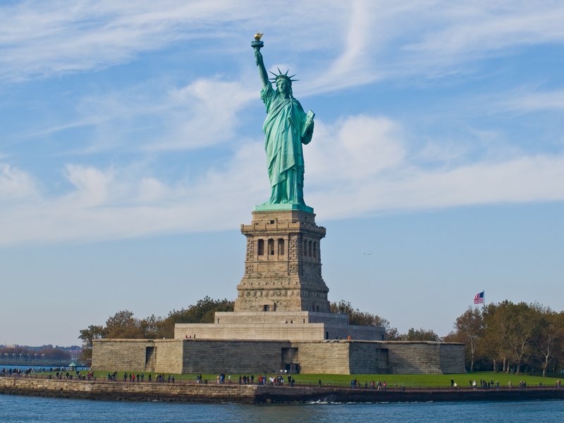 Statue of Liberty on Liberty Island with New York harbour behind