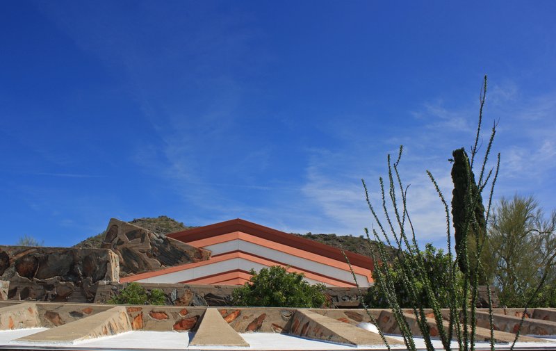 The desert masonry walls and angled roofs of Taliesin West in Scottsdale