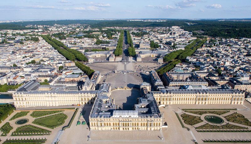 Aerial view of the Palace of Versailles and its formal gardens