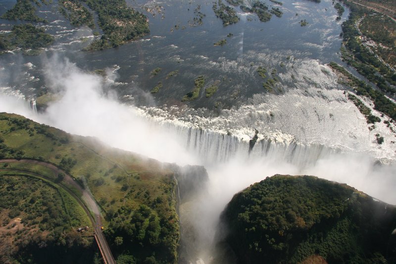 Victoria Falls in full flood with mist rising from the Zambezi gorge