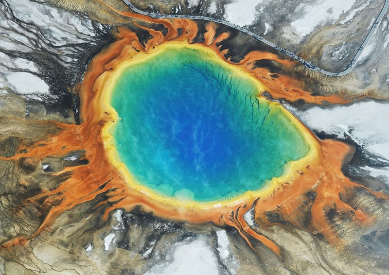 Aerial view of Grand Prismatic Spring's vivid colour rings from above
