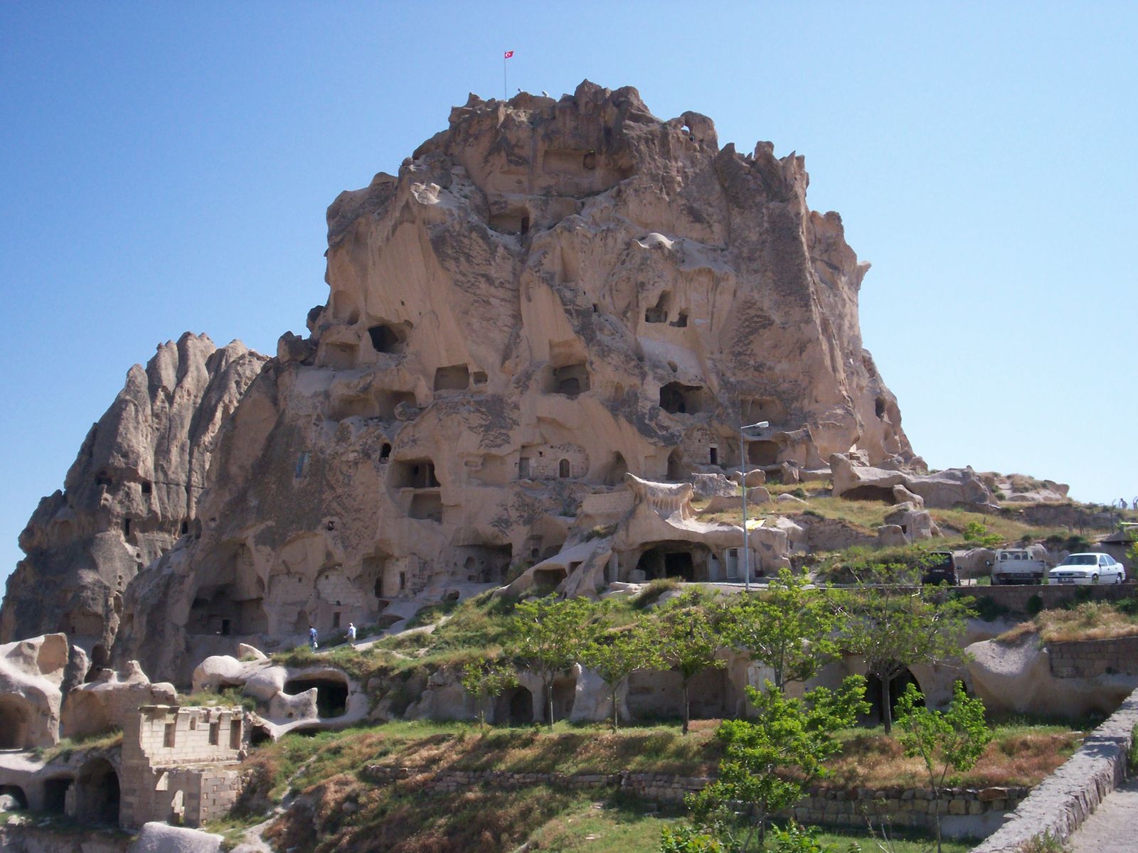 Uçhisar rock castle formation rising above the Cappadocia plateau, Turkey