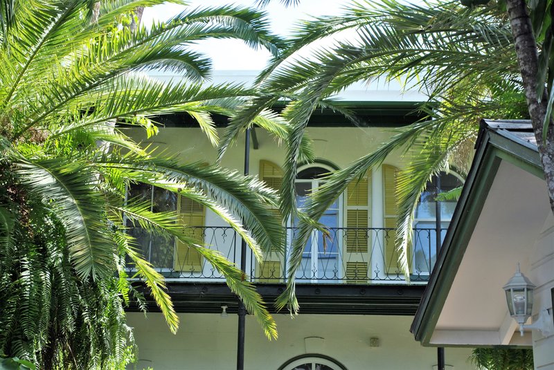 The Spanish Colonial facade and verandas of the Ernest Hemingway Home in Key West