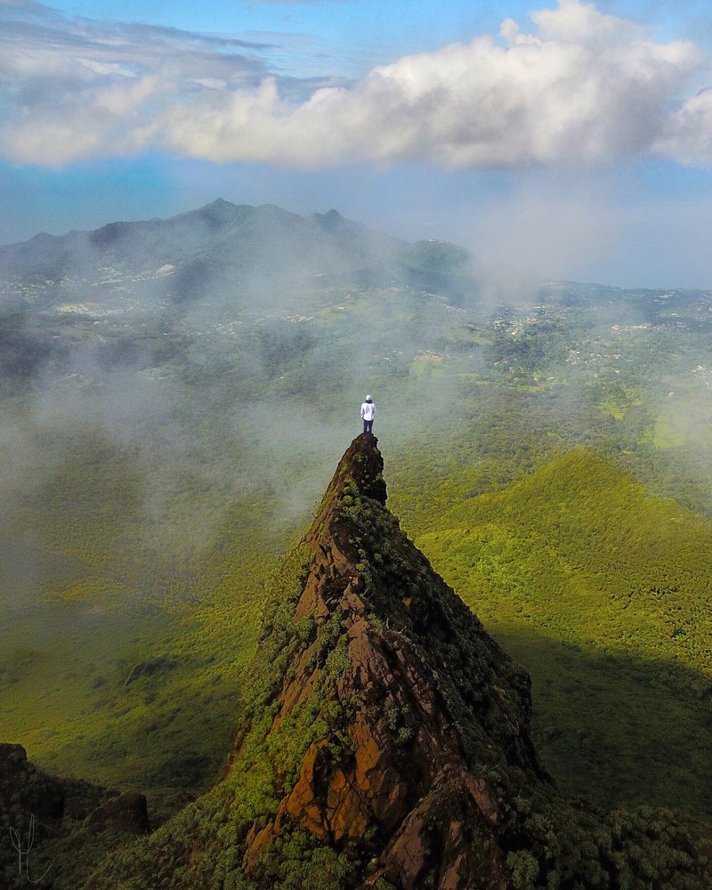 Summit of La Soufrière volcano rising through mist, Guadeloupe