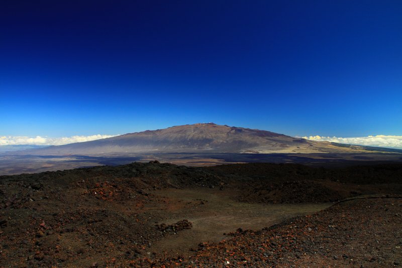 Mauna Kea's summit with observatories above the clouds on Hawaii Island