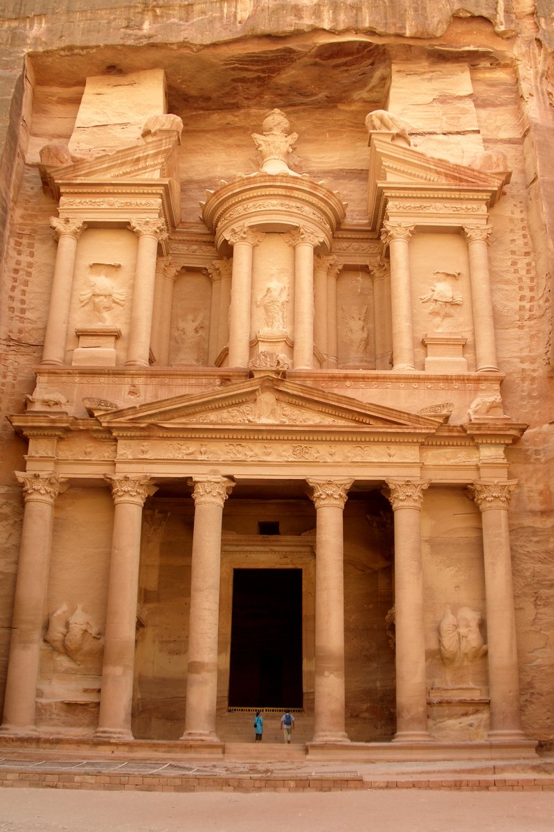 Al-Khazneh (The Treasury) facade carved into rose-red sandstone cliffs in Petra