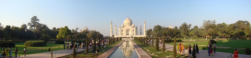 Panoramic view of the Taj Mahal and its reflecting pool from the south gate