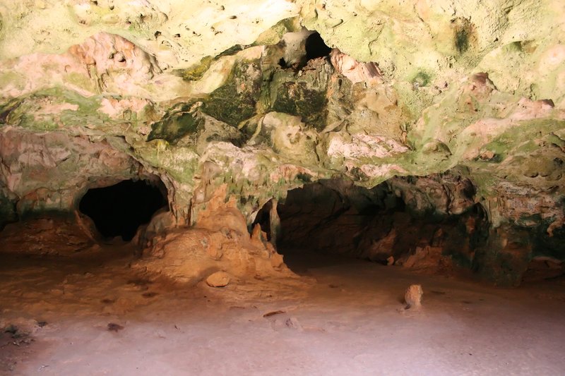 Guadirikiri Cave interior with light shafts through collapsed roof openings, Arikok National Park, Aruba