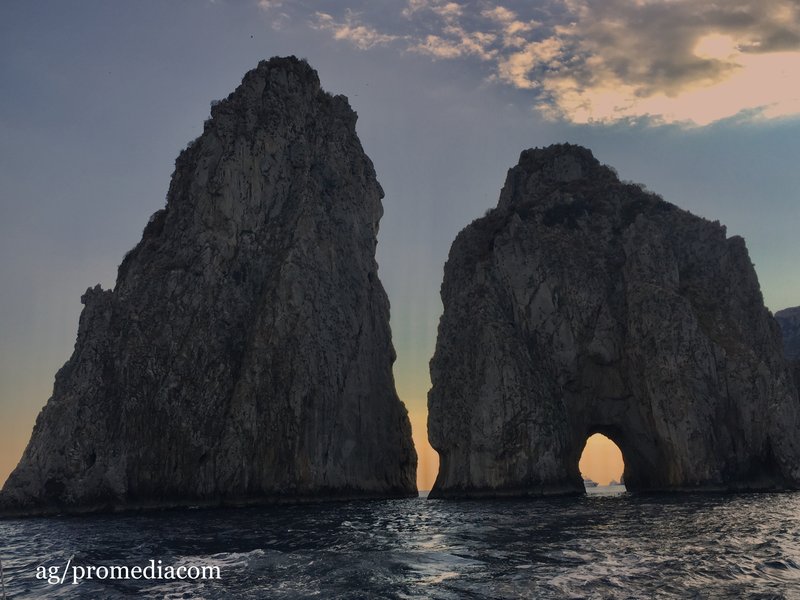 The three Faraglioni sea stacks seen from the Capri cliffs