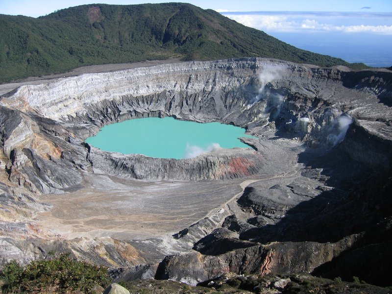 Poás Volcano acid crater lake with steam