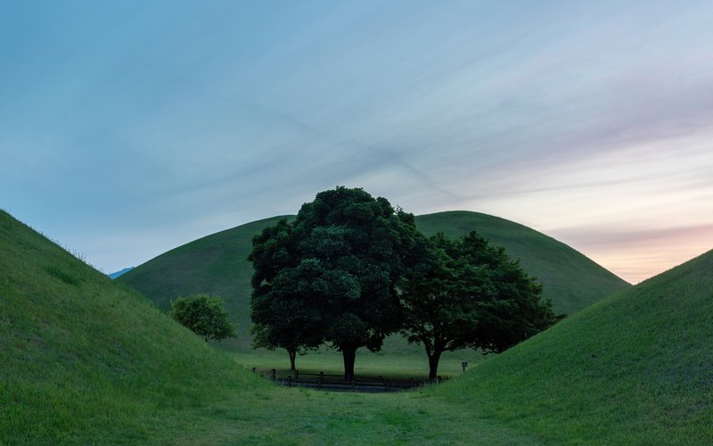 Grass-covered burial mounds at Daereungwon Tomb Complex in Gyeongju
