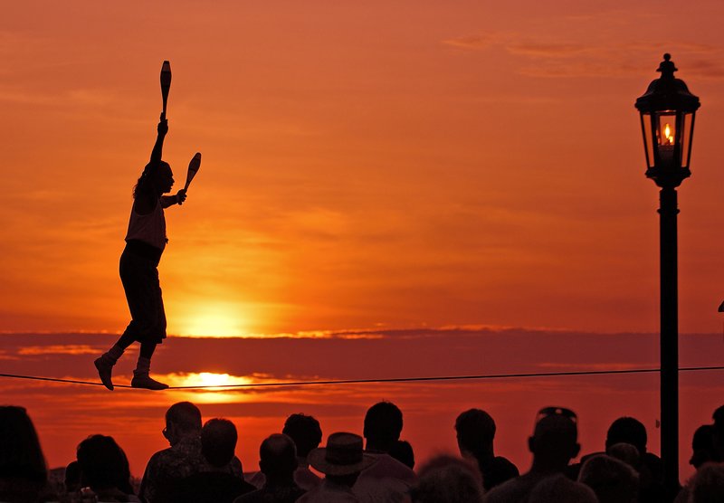 Tightrope walker performing at Mallory Square Sunset Celebration, Key West