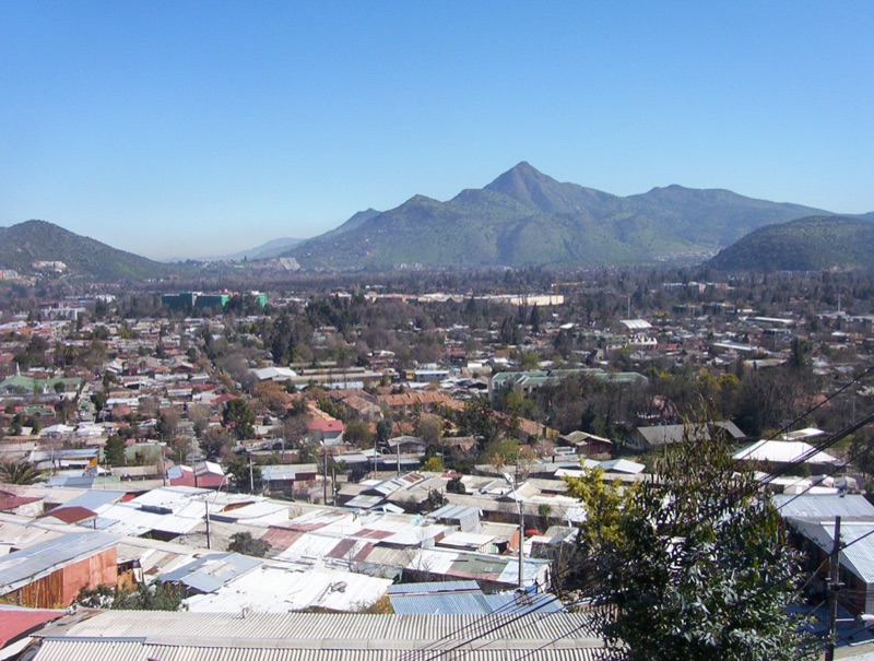 Cerro Manquehue — summit ridge rising above Santiago with Andes backdrop